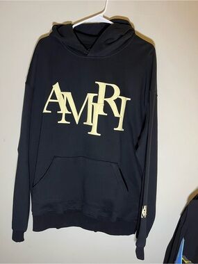AMIRI Black Hoodie with Cream Lettering